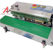 Automatic continuous band sealer polythene pvc aluminum puffed food sealing machine,